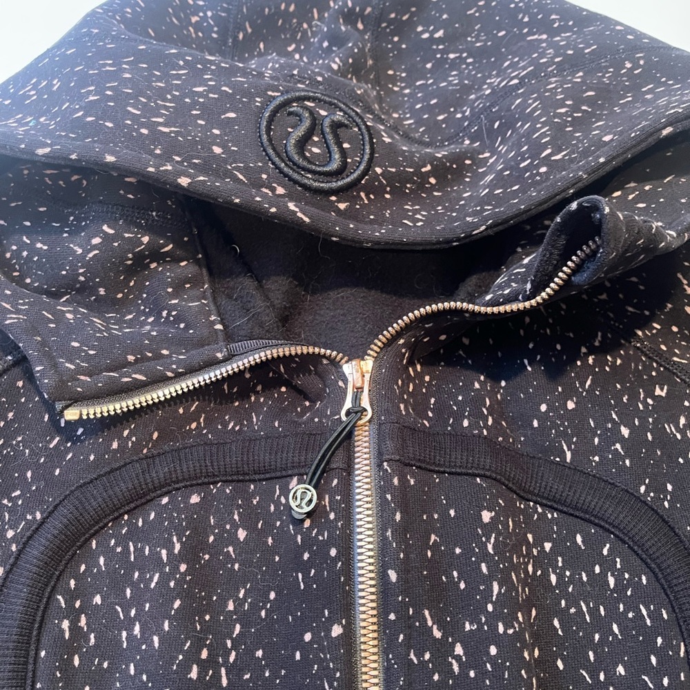 Lululemon Hoodie. Black pattern with brass color zipper. Like new.